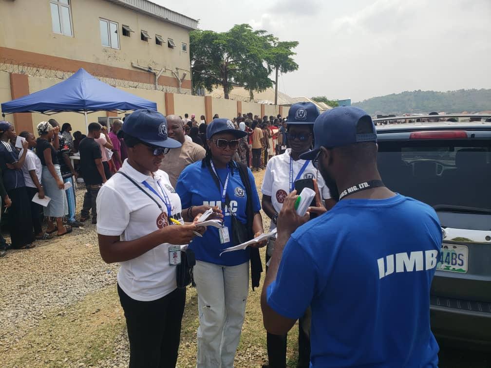 MMCAAT staff members assisting candidates at an outdoor event