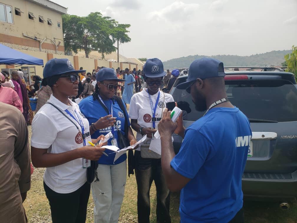 MMCAAT staff registering and guiding attendees outside
