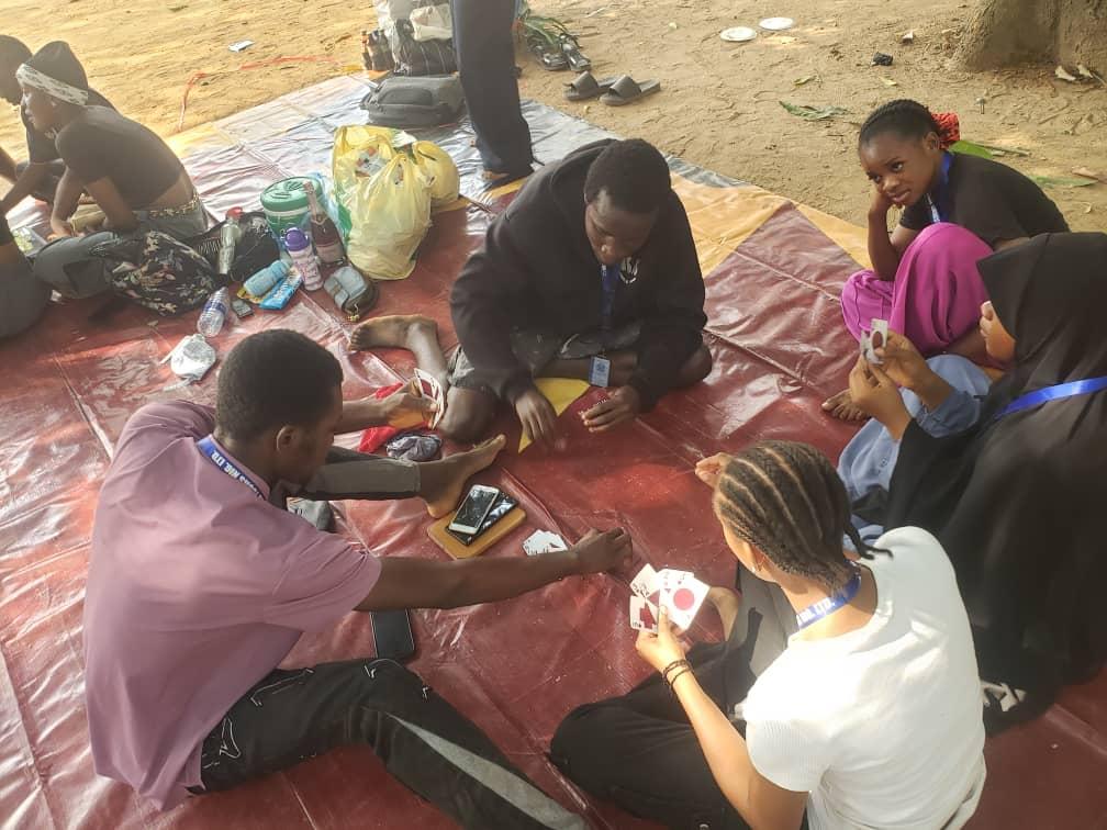 MMCAAT students playing cards and enjoying activities at a tour picnic